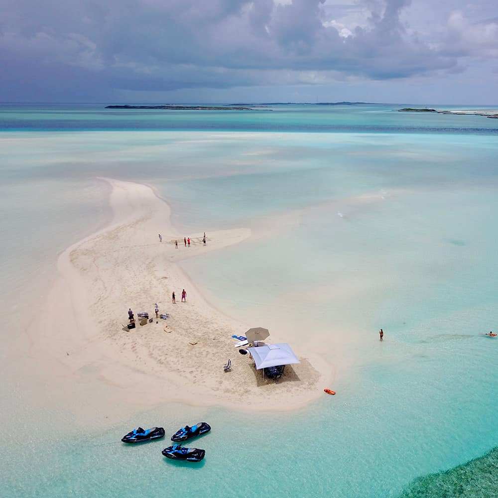 Charter guests from Motor Yacht Loon enjoying an excursion to Big Major in the Bahamas