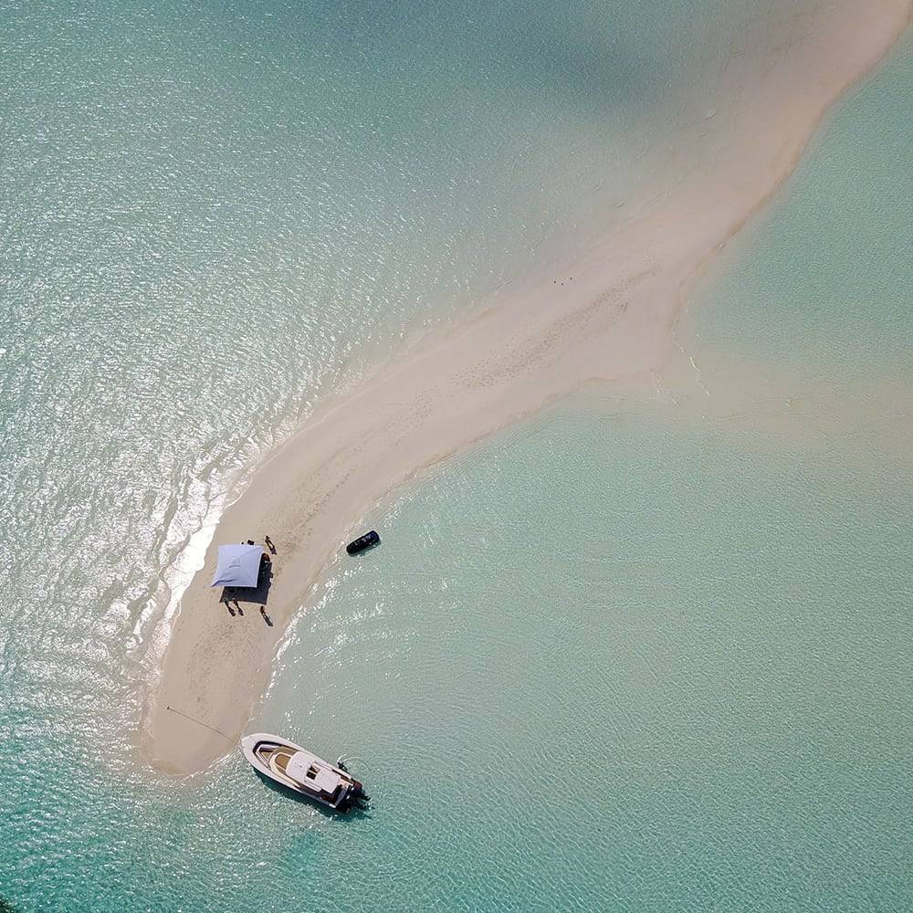 Drone image of tender from Motor Yacht Loon at Musha Cay in the Bahamas during a luxury superyacht charter