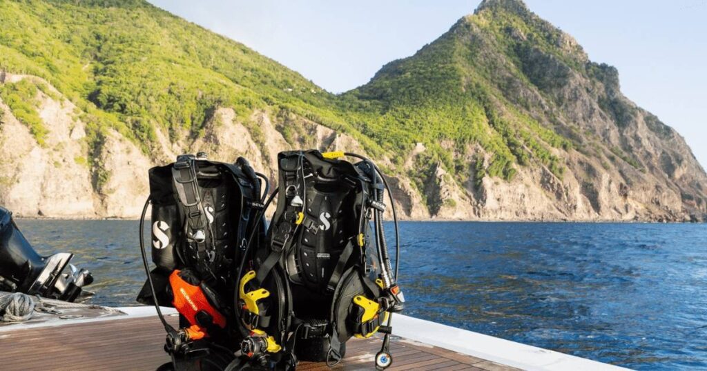 Motor Yacht Loon diving centre and Scubapro oxygen tanks on the stern with St Vincent in the background