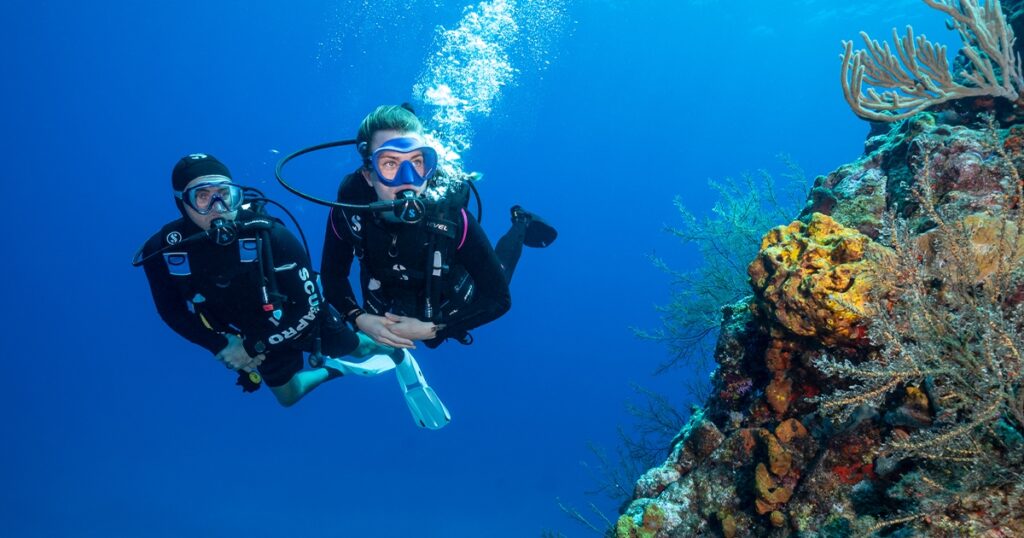 Charter Superyacht Loon guests scuba diving off Motor Yacht Loon