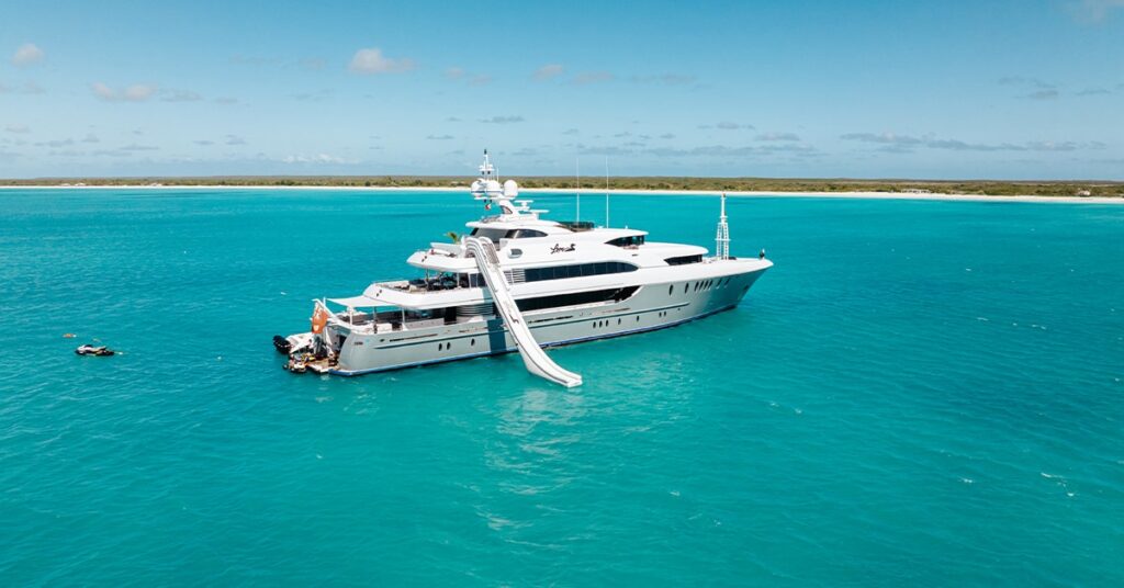 The FunAir Yacht Slide on MY Loon anchored in azure blue sea