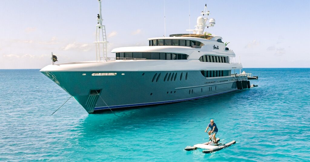 Guest from Motor Yacht Loon using a Schiller bike in the blue Caribbean sea