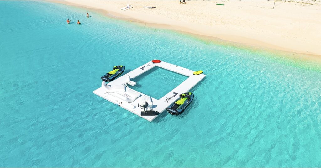 Charter Superyacht Loon Seadoo GTI Jet Skis by the side of the FunAir Beach Club Sea Pool on a Caribbean shoreline