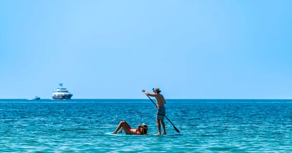 Charter guest enjoying solitude on a stand up paddle board