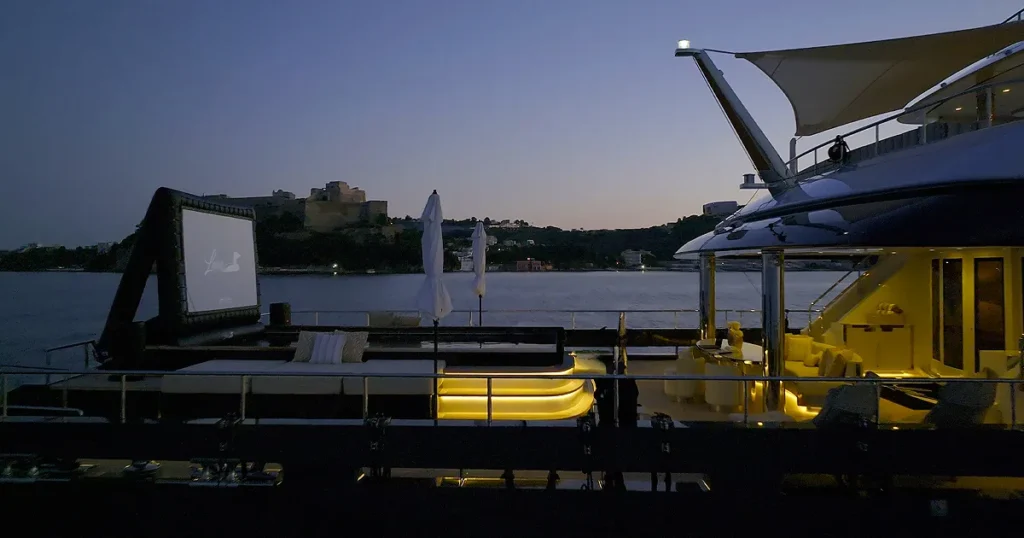 The swimming pool and inflatable cinema screen on charter yacht Loon